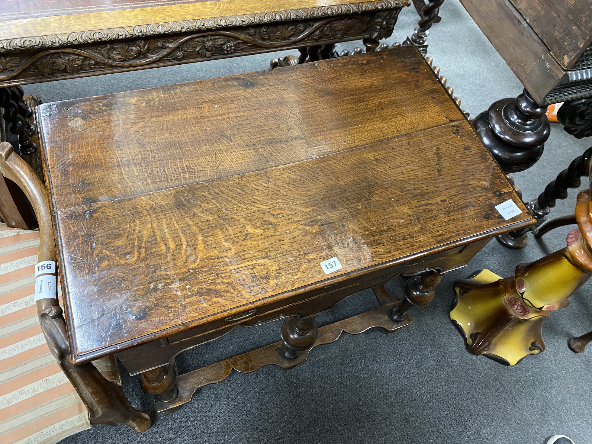 A William and Mary oak side table, c.1690, with a drawer and arcaded gallery, the five upturned vase shaped legs joined by peripheral stretchers, width 80cm, depth 49cm, height 71cm